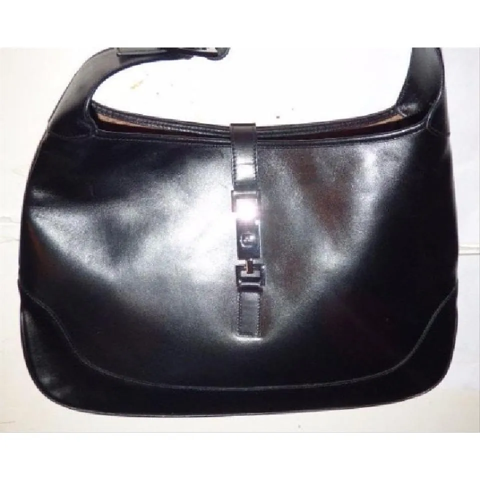 SOLD- Gucci, extra large size, classic, Jackie- O bag, made in hard to find,black all leather with a chrome piston closure and buckle